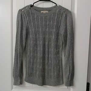 Sweater with cute button details.